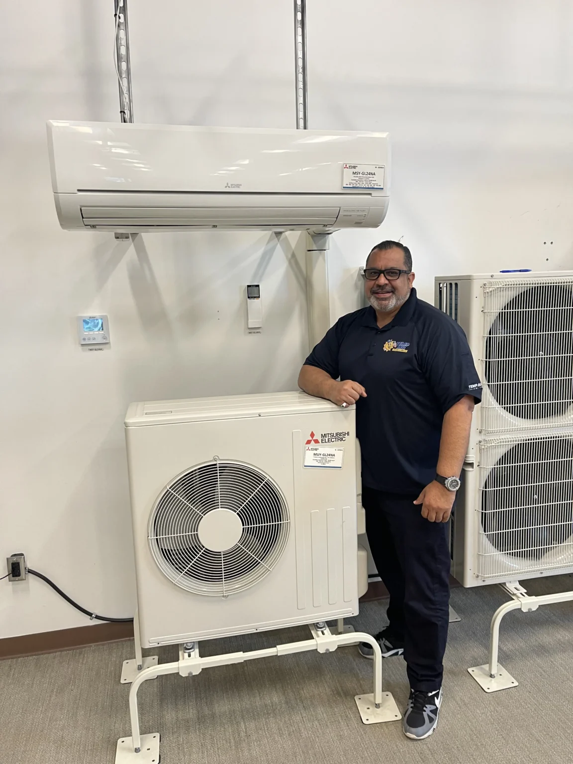 Technician waith HVAC units | Dr. Ductless Heating & Cooling